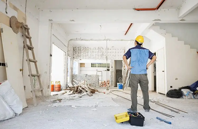 Builder assessing renovation site for Builders Alexandra's Renovations Alexandra service.